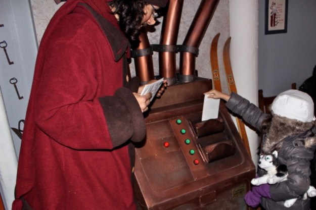 Santa's mail delivery machine delivers children's letters to him no matter where he is!