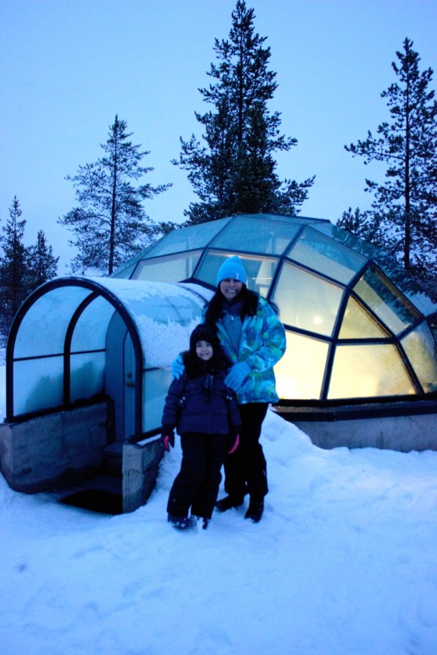 This is Mia and I in front of one of the beautiful glass igloos lit up before dark.