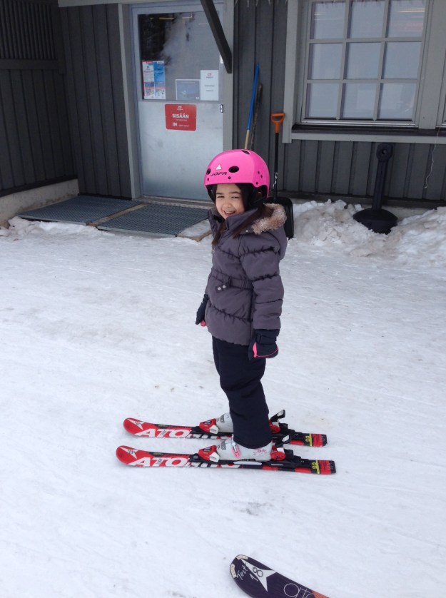 Mia with a pair of snow skis on for the first time!